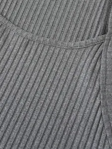Macro detail shot of grey ribbed knitted fabric for men's athletic performance tank top
