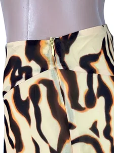 Detailed close-up showing the invisible back zipper of a chic leopard print mini skirt