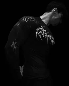 Close-up of men's Breathedivinity athletic compression shirt with gothic graphic prints