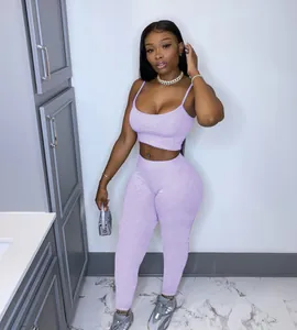 Casual purple two-piece set featuring a camisole crop top and matching high-waist leggings