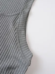 Close-up of the ribbed knit fabric and seamless stitching on a grey men's sleeveless tank top.