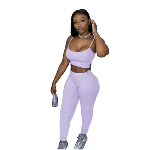 Full view of woman wearing a light purple two-piece casual sports set with tank top and leggings