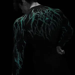 Back detail of men's compression workout t-shirt featuring a unique teal lightning print