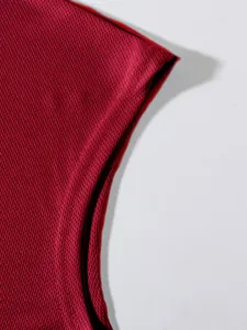 Detailed macro view of red breathable mesh fabric texture for men's gym tank top