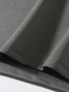 Close-up detail of the breathable grey mesh fabric texture on this men's athletic sport vest