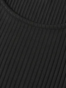 Close-up detail of the black ribbed knit fabric texture and the neckline stitching of the vest.