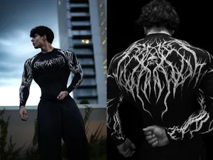 Detailed view of men's black compression shirt with white gothic thorn and skull prints
