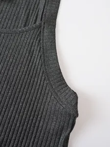 Macro detail of dark grey ribbed knit fabric texture on men's sleeveless training tank top