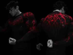 Detail of Breathedivinity mens black compression shirt with red graphic print design.