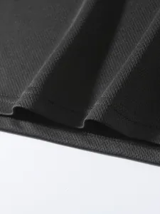 Macro view of breathable mesh fabric and durable double stitching on sports t-shirt.