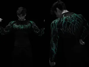 Macro view of men's black compression gym shirt featuring green lightning patterns