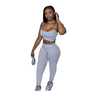 Two-piece grey knit activewear set with crop cami top and high-waisted leggings