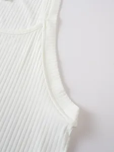 Macro detail of white ribbed knit men's tank top showing high-quality stitching and fabric
