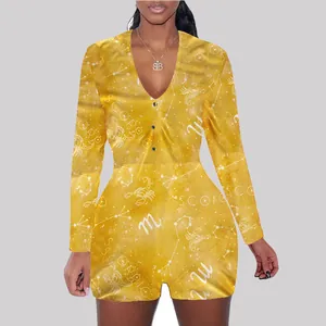 Detail view of yellow long sleeve romper jumpsuit with Scorpio constellation print