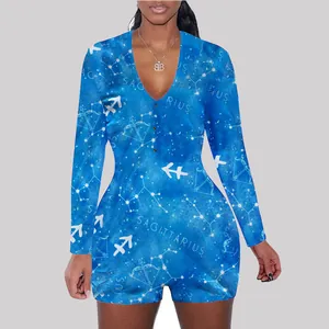 Close-up detail of celestial Sagittarius zodiac print on blue long-sleeved lounge romper