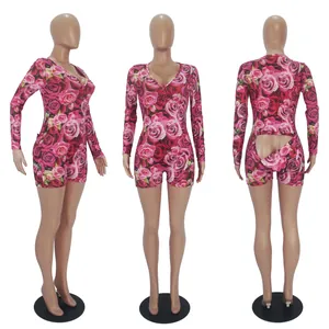 Detailed view of long-sleeved floral romper showing front, side, and rear button flap.
