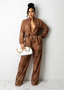 Elegant brown long sleeve jumpsuit with cursive print and deep V-neckline