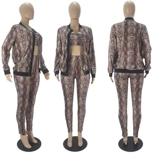 Stylish three-piece women's set with snakeskin print cardigan, crop top, and slim leggings