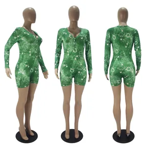 Detailed view of green Taurus constellation print long sleeve short romper from three angles