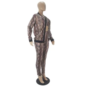 Detailed side view of women's snake skin print three-piece clothing set on a mannequin
