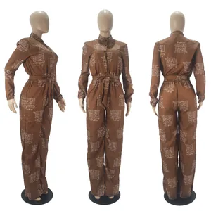 Three-view detail of a brown long-sleeve jumpsuit with script print and waist belt.