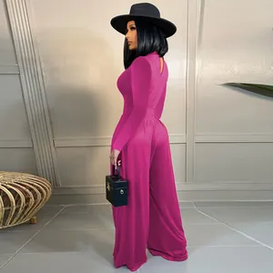 Side back view of chic magenta long sleeve bodysuit and high waist wide leg trousers set