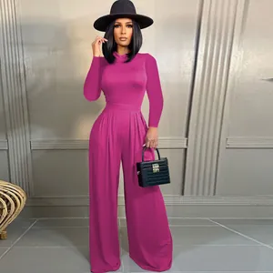 Elegant fuchsia two-piece set featuring long sleeve bodysuit and flowing wide-leg pants