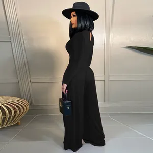Elegant black long sleeve bodysuit paired with flowing wide leg pants for women
