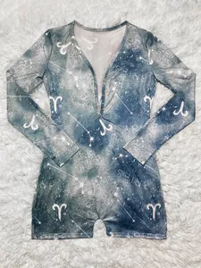 Detail view of Aries constellation print on a long-sleeved loungewear romper