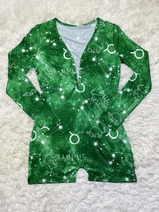 Close-up view of a green Taurus constellation print long-sleeve shorts romper