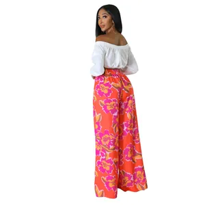Lässige weit geschnittene Hose mit hohem Bund und lebhaftem Blumenmuster in Orange