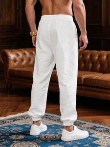 Back view of men's breathable white leisure jogger pants in an elegant indoor setting