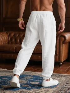 Back view detail of men's white lightweight breathable cotton casual jogger pants