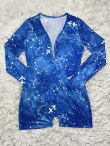 Close-up of Sagittarius constellation print and snap buttons on blue long sleeve romper