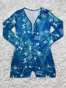 Macro view of blue long sleeve romper featuring white Pisces zodiac and constellation print.