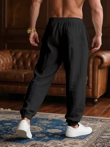 Back view of men's lightweight black breathable jogger pants for summer leisure