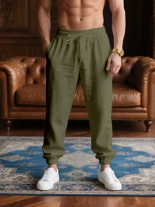 Detailed view of olive green casual joggers with drawstring and elastic cuffs