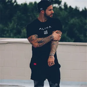 Detail of men's black ALPHA athletic t-shirt and shorts set shown on a fitness model