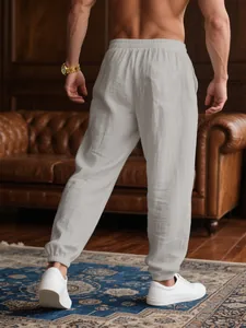 Back view of men's breathable linen casual joggers in light grey for summer resort