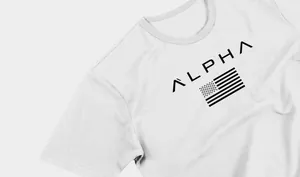 Detailed macro view showing the ALPHA text and flag print on a white athletic t-shirt
