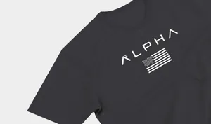 Close-up of charcoal men's sports t-shirt with white ALPHA and flag print