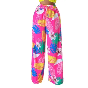 Weit geschnittene Hose mit lebhaftem tropischem Blumenmuster und bequemer elastischer Taille.