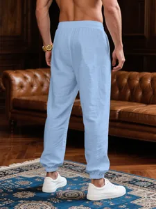Back view of light blue breathable linen-style joggers perfect for men's summer casual wear