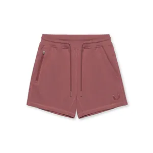 Short de sport pour homme rose poudré avec cordon de serrage et poche zippée latérale