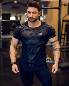 Close-up of black tight muscle fitness t-shirt with geometric honeycomb pattern