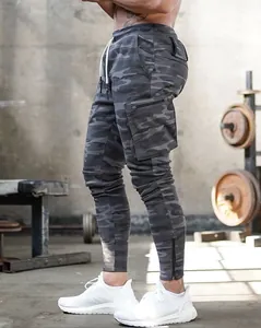 Detailed side view of men's camouflage cargo joggers with functional zipper pockets