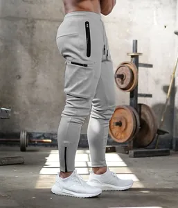Men's athletic grey cargo joggers with multiple zipper pockets for fitness and gym training