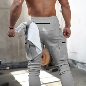 Rear detail view of grey men's gym cargo pants with functional towel loop and pockets