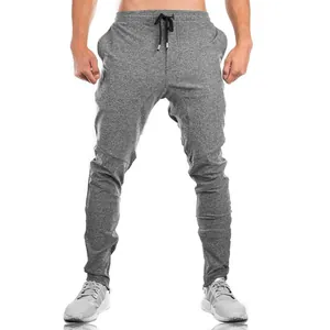 Men's grey slim-fit joggers with drawstring waist for fitness and workout training