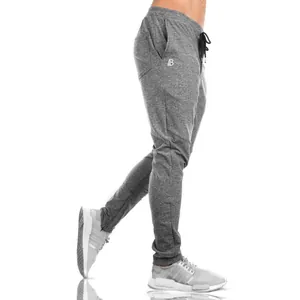 Men's slim-fit grey joggers with tapered leg and drawstring waist for gym workouts